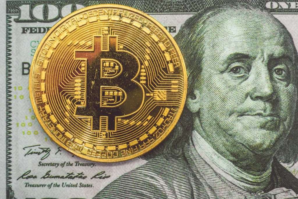 Bitcoin on hundred dollars bills